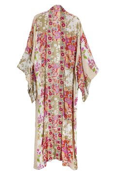 Hit the beach or kick it poolside in this flowy kaftan that features an allover floral pattern, kimono-inspired sleeves and an uneven hem. Kimono-inspired sleeves 100% rayon Hand wash, line dry Imported Multicolor Print Kimono For Spring Beach Cover-up, Multicolor Kimono Beach Cover-up, Multicolor Printed Cover-up With Kimono Sleeves, Patterned Flowy Kimono With Kimono Sleeves, Printed Tunic Cover-up For Spring, Spring Flowy Kaftan Beachwear, Multicolor Boho Print Kaftan For Spring, Spring Multicolor Boho Print Kaftan, Flowy Multicolor Printed Kimono