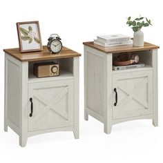 two white wooden nightstands with one open and the other closed, both side by side