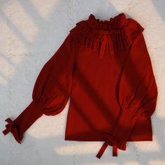 Size 			S 			M 			L 		 		 			Full Length 			56 			58 			60 		 		 			Bust 			80 			84 			88 		 		 			Waist 			70 			74 			78 		 		 			Neck Circumference 			18 			19 			20 		 		 			Sleeve Length 			58 			59 			60 Long Sleeve Sweater With Ruffles For Fall, Ruffled Long Sleeve Sweater For Winter, Red Long Sleeve Knit Top For Fall, Burgundy Knitted Sweater For Fall, Red Long Sleeve Knit Top For Winter, Ruffled Knit Top For Fall, Red Knitted Long Sleeve Tops, Red Long Sleeve Knit Top For Spring, Burgundy Knit Top For Fall