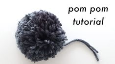 a black pom - pom on top of a white surface with the words pom pom written below it