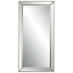 a mirror that is sitting on top of a wall with a gold frame and silver trim