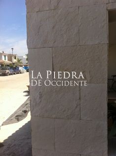 a sign that reads la piedra de occidente on the side of a building