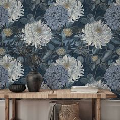 Elevate your home decor with this elegant blue floral wallpaper, featuring large chrysanthemums and intricate leaf designs. The sophisticated color palette of blues and golds adds a touch of luxury to any space, making it perfect for living rooms, bedrooms, or dining areas. This wallpaper's detailed pattern brings a sense of calm and beauty, ideal for creating a feature wall or enveloping a whole room in serene elegance. The high-quality design and classic floral motif ensure this wallpaper wil… Grey Floral Wallpaper, Peel And Stick Mural, Blue Floral Wallpaper, Dining Room Blue, Redecorating Ideas, Favorite Wallpaper, Dining Room Wallpaper, Navy Wallpaper, Leaf Designs