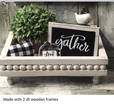 a wooden tray with a sign and potted plant on it that says father love