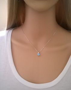 Similar items: ALLDANAE.etsy.com Please read my shop policies before ordering: https://www.etsy.com/shop/AllDanae#policies A beautiful blue topaz gem strung on a sparkling sterling silver chain. The sky blue color of the topaz is exquisite. It measures just 6mm (about 1/4 inch) in diameter, and has excellent clarity and sparkle. The necklace length is customizable. Choose your perfect size from the drop down menu. ♥ Please note: my jewelry is not intended for infants or young children. Necklaces Swiss Blue Topaz Necklace, Diamond Necklace Simple, Blue Topaz Pendant Necklace, Blue Gemstone Necklace, December Birthstone Jewelry, Natural Gemstone Necklace, Silver Jewelry Box, Sky Blue Color, Blue Topaz Necklace