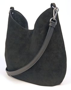 "This beautiful and luxuriously soft suede hobo bag will be a fashionable and chic addition to any ensemble. Crafted from a premium calf suede and fully lined with cotton canvas. This bag also features (2) interior 7\" zipper pockets, crossbody or shoulder strap, snap closure, pleats on bottom, silver hardware and hand painted edges. Handmade in Denver, CO. USA Dimensions: Width at widest- 14\" Height at tallest- 13\" Weight- 1 lb. 9 oz. Not finding exactly what you want? Sean Ray can make it fo Chic Suede Bucket Bag With Removable Pouch, Elegant Suede Bucket Bag Tote, Chic Suede Bucket Bag With Suede Lining, Chic Suede Bucket Bag For Everyday, Modern Suede Hobo Bag With Leather Handles, Modern Suede Hobo Bag With Double Handle, Chic Bucket Bag With Suede Lining For Everyday, Evening Suede Hobo Bag With Soft Leather, Everyday Hobo Bag With Suede Lining