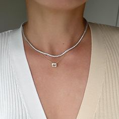 Level up your style with this Mae Round Tennis Necklace! Boasting 2mm Moissanite stones arranged in a linear design, this sterling silver piece is a timeless classic that embodies eternity. Luxury Rose Gold Round Tennis Necklace, Luxury White Moissanite Tennis Necklace, Moissanite Tennis Necklace, Luxury Gemstone Tennis Necklace For Formal Occasions, Timeless Tennis Necklace With Diamond Cut As Gift, Timeless Diamond Cut Tennis Necklace As A Gift, Elegant Tennis Necklace With Single Cut Diamonds As Gift, Timeless Tennis Necklace With Diamond Cut For Gift, Timeless Tennis Necklace With Diamond Accents Gift