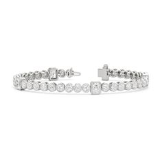 A sweeping sense of sophistication is deeply embedded within this tennis bracelet's timeless design. Bezel-set radiant and round diamonds line up to form a pattern, leading the eye from one flash of sparkle to another. Fastening the bracelet onto your wrist is a secure tongue-and-clip clasp. Luxury Diamond Tennis Bracelet With Channel Set, Luxury Diamond Channel Set Tennis Bracelet, Luxury Channel Set Diamond Tennis Bracelet, Formal Diamond Tennis Bracelet Channel Set, Elegant Tennis Bracelet In Diamond White With Bezel Setting, Elegant Diamond White Tennis Bracelet With Bezel Setting, Classic Bezel Setting Tennis Bracelet For Formal Occasions, Luxury Diamond White Tennis Bracelet With Bezel Setting, Elegant Diamond Tennis Bracelet With Bezel Setting