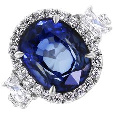 An enviable jewel, this ring sports some dazzling Diamonds & a sparkling Sapphire. Gemstones Type: Sapphire Gemstones Shape: Oval Gemstones Weight: 5.92 ct Gemstones Color: Blue Diamonds Shape: Round & Radiant Side Diamonds Weight: 1.75 ct Side Diamond Color: F - G Side Diamond Clarity: VS (Very Slightly Included) Metal: 18K White Gold Metal Wt: 4.3 gms Setting: Prong & Pave Finger Size: 7 Luxury Brilliant Cut Sapphire Gemstones, Dazzling Sapphire Ring With Accent Stones, Gia-certified Cluster Sapphire Ring With Diamond, Gia Certified Cluster Sapphire Ring With Diamond, Luxury Cluster Sapphire Ring Gia Certified, Luxury Gia Certified Cluster Sapphire Ring, Luxury Rings With Lab-created Sapphire And Prong Setting, Luxury Cushion Cut Sapphire Ring With Vvs Clarity, Luxury Gia Certified Cushion Cut Sapphire Ring