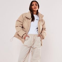 Stone Oversized Puffer Jacket By Missguided Color Is Beige/Cream/Tan Family Spring Puffer Outerwear For Streetwear, Spring Streetwear Puffer Outerwear, Neutral Winter Outerwear With Pockets, Urban Puffer Jacket With Pockets For Spring, Urban Style Spring Puffer Jacket With Pockets, Oversized Puffer Jacket With Pockets For Work, Urban Puffer Outerwear For Fall, Casual Puffer Jacket With Ribbed Cuffs, Winter Utility Jacket With Long Sleeves And Ribbed Cuffs