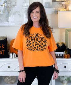 Embrace the fall season with a touch of wild style in the Black Leopard Pumpkin Graphic Shirt. This shirt features a striking black leopard print pumpkin, adding a trendy twist to your autumn wardrobe. Perfect for pumpkin season, it combines the classic pumpkin design with a fierce leopard pattern. Available in sizes YXS-5XL and your choice of shirt color, this graphic shirt is ideal for showcasing your love for fall with a fashionable edge. Trendy Orange Fall Tops, Orange Relaxed Fit Tops For Fall, Relaxed Fit T-shirt For Fall, Orange Cotton Top For Fall, Orange Cotton Tops For Fall, Leopard Print Pumpkin, Pumpkin Graphic, Leopard Pumpkin, Pumpkin Season