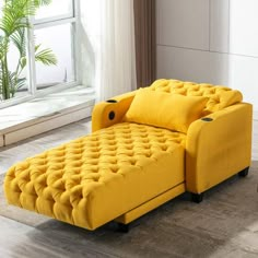 a yellow couch sitting on top of a wooden floor