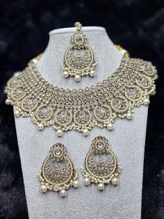 beautiful polki necklace sets with chandbali style Earrings and Tikka.   colors available in  ✨️gold white  ✨️Teal Party Bridal Chandbali Necklace With Pearl Drop, Party Bridal Necklace With Pearl Drop Chandbali, Diwali Bridal Necklace With Pearl Drop In Silver, Silver Bridal Necklace With Pearl Drop For Diwali, Diwali Bridal Necklace With Pearl Drop, Silver Kundan Pearl Necklace With Round Shape, White Chandbali Pearl Necklace For Party, Party Pearl Drop Chandbali Necklaces, Silver Pearl Chandbali Necklace With Meenakari