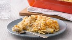 a piece of chicken casserole on a plate with a fork