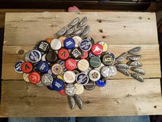 a wooden table topped with lots of bottle caps