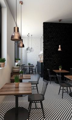 an empty restaurant with black and white checkered flooring, wooden tables and chairs