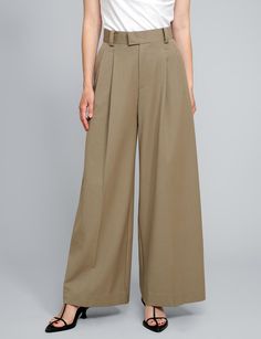 Tan high-waisted pants . Styled with Olympia Tee . 80% polyester, 20% rayonSide pocketsBack faux pocket Size S waist 26.5", hips 37", length 41" Inseam 30" Size M waist 28", hips 39", length 42" Inseam 30.5Size L waist 29.5", hips 40", length 43" inseam 31" Model wears size S and is 5.8"/ 170 cm Imported Fall Wide Leg Work Pants With Welt Pockets, Full-length Cargo Pants For Workwear In Spring, Full Length Cargo Pants For Workwear In Spring, Summer Wide Leg Work Pants With Welt Pockets, Chic Wide-leg Work Pants With Pockets, Relaxed Fit Wide Leg Work Pants With Belt Loops, Wide Leg Work Pants With Welt Pockets For Summer, Beige Wide Leg Pants With Belt Loops, Spring Full-length Wide Leg Pants With Hip Pockets