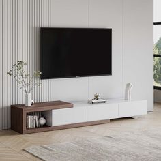 a living room with a large flat screen tv mounted on the side of it's wall