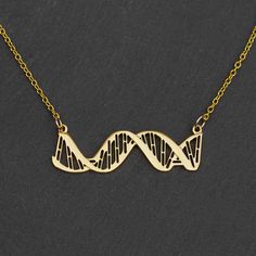 If you work with, study, or have genetic material, then this DNA necklace is for you. The highly detailed DNA pendant is strung in-line with the chain shows the major and minor grooves, as well as a representation of base pairing. It also has tiny engraved details to accurately represent the right-handed direction of the double helix twist. The pendant is made from polished steel and comes in silver, gold, and rose gold colors and a variety of chains. It is elegant enough for formal occasions an Dna Necklace, Stem Teacher, Double Helix, Gold Colors, Science Teacher, Medical Students, Gold Plated Chains, Rose Gold Color, Helix