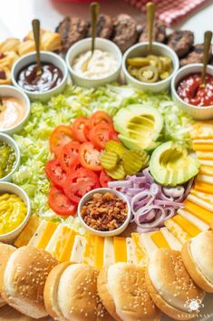 a platter filled with sandwiches and condiments