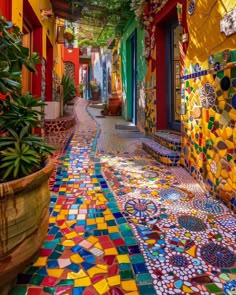 an alley with colorful tiles and potted plants