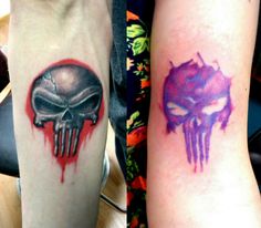 two tattoos that have different designs on their arms, one with a skull and the other with a demon's head