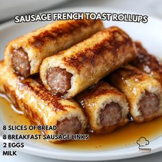 sausage french toast roll ups on a white plate with brown sauce in between them and the words, sausage french toast rolls slices of bread breakfast sausage links