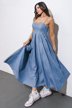 An artfully washed midi dress in soft denim, boasting a sleek straight neckline and delicate shoulder straps finished with inverted pleats. The exquisite back tie closure adds a touch of elegance to this effortlessly chic piece.Details:Self : 90% Cotton 10% PolyesterSize & Fit- Model is 5`7" And Wearing Size Small- Measurements Taken From Size Small- Approx. Length: 51" Formal Denim Dress, Moda Casual Chic, Vestidos Maxi, Denim Maxi Dress, Best Winter Outfits, Denim Midi Dress, Moda Jeans, Jean Dress, Flying Tomato