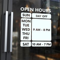 an open hours sign on the door of a building