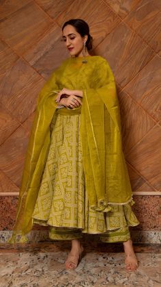 PRODUCT DESCRIPTION:﻿﻿ Kurt (Anarkali): Cotton Pants: Cotton Dupatta: Organza No. Of Components : Set of 3 Length of anarkali: 48inches Length of pants: 38inches Length of dupatta: 2.50 meters Margin left: 2inches Product Highlights: Tassels at the back of anarkali and gotta lace work at the bottom ,neck & sleeves of anarkali and pants. Wash Care : ﻿Dry Clean Customization : Only Size and Length Of Product SKU#: 11403047GR Disclaimer: All our pieces are handcrafted in our manufacturing unit .W Traditional Drape Mulmul Palazzo Set For Wedding, Anarkali Choli In Chanderi With Dabka Details, Festive Sharara With Pallu, Diwali Art Silk Anarkali Set With Dabka, Traditional Green Floor-length Palazzo Set, Designer Green Choli With Dabka Detailing, Semi-stitched Anarkali Palazzo Set With Pallu, Anarkali Slub Silk Set With Pallu, Anarkali Palazzo Set In Pista Green With Traditional Drape