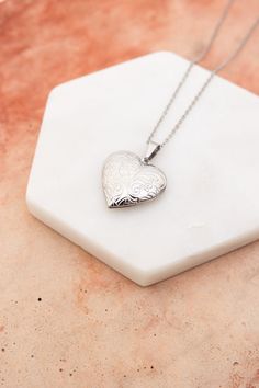 The Love Me Heart Heart Locket Necklace is the perfect way to show someone you care. Available in gold and silver, this cute necklace is a perfect gift for any occasion. Spread love and happiness with this adorable accessory. #lovemyleto #completeyourlook 100% Stainless Steel Imported