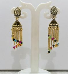 This Unique pair of Earrings is designed and crafted at PraNiCollectioNs  PraNiCollectioNs is the place for anyone who Is in lookout for a latest trend with an ethnic touch.  We at PraNiCollectioNs offers a great range of Indian Ethnic jewellery's. We are strongly committed to  providing our customers  some uniquely handcrafted products with utmost satisfaction. These jewellery's are made from high quality  material which are Hypoallergenic and are also free from corrosion and rusting This listi Temple Jewelry Tilla Jhumkas, Multicolor Temple Jewelry Earrings, Multicolor Temple Jewelry Earrings With Latkans, Handmade Metal Dangle Jhumkas, Temple Jewelry Kundan Jhumkas For Pierced Ears, Handmade Metal Jhumkas, Temple Jewelry Plug Earrings With Latkans For Festivals, Temple Jewelry Style Metal Chandelier Earrings, Multicolor Oxidized Temple Jewelry Earrings