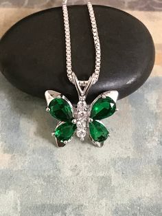 Sterling Silver Emerald CZ Butterfly Necklace Emerald is the birthstone for May. This makes a perfect gift for those loved ones born in May. Metal: All components are made from solid .925 Sterling Silver Stone: Cubic Zirconia Measurement: pendant height is 18mm including bail and 17mm at widest part Choose Chain Length At Checkout You can find other CZ and Birthstone Jewelry in my shop here https://www.etsy.com/shop/LinksAndStones?ref=seller-platform-mcnav&section_id=24399452 Please feel fre Green Cubic Zirconia Necklace For Gift, Nickel-free May Birthstone Necklace For Anniversary, Cubic Zirconia Pendant Jewelry For Birthdays, May Birthstone Pendant Jewelry For Mom, Birthday Cubic Zirconia Pendant Jewelry, May Birthstone Pendant Jewelry Gift For Mom, Hypoallergenic Jewelry For May Birthstone Gift, Cubic Zirconia Necklace For May Birthstone Gift, Sterling Silver Necklace For May Birthstone