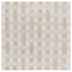 a beige and white rug with squares on it