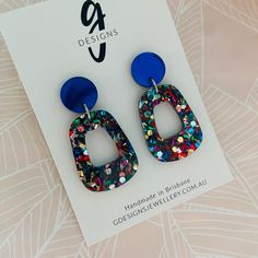 Acrylic - Statement Earrings  - Hollow Trapezium Drop - Dangles - Rainbow Glitter - Royal Blue Mirror Stud Top Free Aus Shipping. If you love colour and sparkle, these are the earrings for you! A 1.4cm mirror stud top with a 3.3cm hollow trapezium dangle in rainbow glitter. Super light-weight and comfortable to wear! All GDesignsJewellery posts and backs are stainless steel suitable for most sensitive ears. FREE Aus Shipping:   Sent as Large Letter via Australia Post.  Allow at least approx. 10-20 days depending on your location.  Hopefully sooner, dependent on Aus Post! Multicolor Pierced Earrings For Party, Multicolor Glitter Dangle Earrings, Multicolor Glitter Drop Earrings, Blue Glitter Dangle Earrings, Iridescent Glitter Earrings For Party, Trendy Silver Glitter Earrings, Trendy Glitter Earrings For Party, Blue Glitter Jewelry For Party, Trendy Multicolor Glitter Jewelry