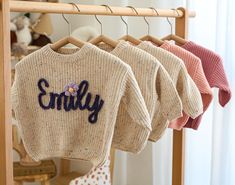 Welcome to our boutique, where we specialize in crafting custom and personalized baby/toddler sweaters that are as unique as your little one. Our flagship product, the "Custom Baby Name Sweater," is designed with utmost care to blend warmth, style, and comfort effortlessly. Personalization: Each sweater can be customized with beautifully embroidered names, ensuring every piece is a cherished keepsake. Warmth and Comfort: Crafted from premium, soft fabrics, our sweaters promise to keep your baby snug and cozy, perfect for colder months. Artisan Craftsmanship: Handcrafted by skilled artisans, each sweater is a testament to meticulous craftsmanship and attention to detail. Quality Materials: We prioritize high-quality, baby-friendly materials that are gentle on delicate skin, ensuring your ch Name Sweater Baby, Baby Name Sweater, Embroidered Names, Baby Jumpers, Name Sweater, Baby Jumper, Toddler Sweater, Personalised Baby, Embroidered Sweater