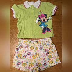 This Outfit Is So Cute! Bright Green Shirt With Peter Pan Collar, Screen Printed Minnie, And Embroidered Flowers. Floral Shorts With Pockets In Front And Back. Height: 31 - 33 Inches Weight: 23 - 26 Pounds New Without Tags - Never Worn! Disney Cotton Tops For Playwear, Disney Green Tops With Character Print, Disney Long Sleeve Sets With Character Print, Cotton Minnie Mouse Short Sleeve T-shirt, Disney Pajamas Kids Size 12, Month Colors, Floral Shorts, Green Shirt, Green Tops