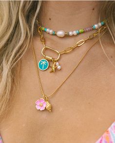 The Hibiscus Necklace is the necklace of the summer! The bright enamel Hibiscus charm paired with a gold conch shell on a ball chain is the perfect representation of the whimsical free spirit of summertime. 24k gold plated tarnish free 19” Cheap White Charm Necklaces For The Beach, Cheap Casual Summer Shell Necklace, Cheap Adjustable Necklaces With Starfish Charm, Cheap Beachy Shell Necklace As A Gift, Cheap Playful Beach Necklaces, Luxury Shell-shaped Beach Necklaces, Preppy Gold Necklaces, Small Business Jewelry Photography, Beachy Necklace Stack