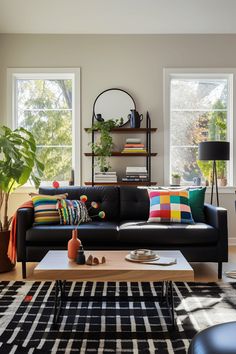 Black Couch Living Room Ideas: Inviting and Colorful Design Inspiration Lively Living Room Ideas, Black Colorful Living Room, Black Couch In Living Room, Living Room With Black Rug Ideas, Colorful Living Room Black Couch, Leather Black Couch Living Room Decor, How To Style A Black Couch, Home Decor Black Couch, Leather Black Sofa Living Room Decor