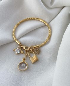 Add a touch of elegance to your look with this stunning gold-plated cuff bracelet, featuring a sparkling key charm and a zircon letter design. This piece combines timeless sophistication with a hint of personal style, making it the perfect accessory for any occasion. ✨ Gold-plated cuff bracelet with a shimmering key charm for a unique, stylish accent 💎 Zircon letter design adds a personal and luxurious touch Crafted with high-quality materials to ensure a long-lasting sparkling finish Versatile design perfect for daily wear or elevating special occasion outfits A thoughtful gift idea for someone special or as a meaningful addition to your jewelry collection Letter Charm Bracelet, Vintage Charm Bracelet, Letter Charm, Special Occasion Outfits, Letter Design, Letter Charms, Jewelry Lover, Vintage Charms, Charm Bracelets