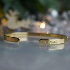 Treat your loved ones with our range of jewellery with meaning - engraved bracelets, necklaces, keychains.  - 22K Gold plated bracelet engraved with your chosen message. - The  thickness of gold plating is around 0.5 microns (it's sufficient even for jewelry pieces that are exposed to rough wear) - Text, coordinates, numbers or handwriting outside and inside the cuff  - Up to 90 characters  on each side - Approximately 5mm wide, 16cm long - The perfect gift for special occasions like Mother's Da Minimalist Engraved Bracelets For Personalized Gifts, Engraved Nameplate Bracelet As Gift, Engraved Nameplate Charm Bracelet For Gift, Engraved Nameplate Charm Bracelet Gift, Minimalist Gold Bangle Bracelet As Gift, Nameplate Bracelet For Valentine's Day Gift, Gold Jewelry With Engraved Text For Mother's Day, Engraved Name Bangle Bracelet As Gift, Adjustable Engraved Name Bracelet For Anniversary