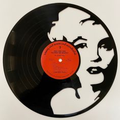 a black and white record with an orange label on it that says, marilyn monroe