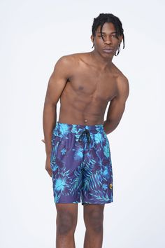 Ai Apparel floral print swim shorts with Ai Logo Tropical Swimwear With Built-in Shorts For Spring, Blue Tropical Print Beachwear Shorts, Blue Tropical Print Shorts, Tropical Print Swimwear, Short Length, Tropical Style Swimwear With Short Length And Tropical Print, Tropical Style Swimwear With Tropical Print, Tropical Short Length Bottoms For Pool, Tropical Style Short Length Pool Bottoms, Tropical Style Short Pool Bottoms