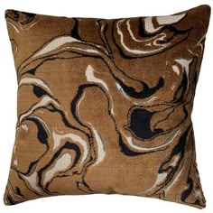 a brown pillow with black and white swirls on it