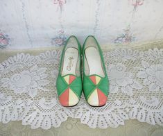 Super cute mod 60's leather pumps in green, pale yellow and salmon. Made by California cobblers. Long squared round toe and low block heel. These have some wear to the leather such as scuffs, places where the color has been rubbed off, marks, and some wear to the heels - see photos. The white insoles are mostly detached from the bottom of the shoe. The shoes do have a bit of a damp grandmas attic smell. Other than these things though, these are such a cute design and have life left in them! Size Vintage Green Round Toe Heels, Vintage Green Heels With Round Toe, Retro Green Round Toe Heels, Retro Green Heels With Round Toe, Green Retro Heels With Round Toe, Retro Green Closed Toe Heels, Green Retro Closed Toe Heels, Green Closed Toe Retro Heels, Vintage Almond Toe Green Heels