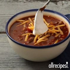 a spoonful of chili and cheese soup