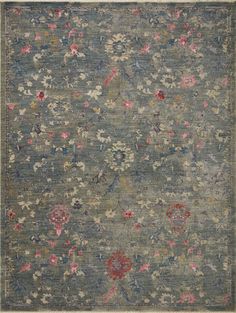 an area rug with various flowers and leaves on the ground, in grey tones that appear to be made from wool or silk