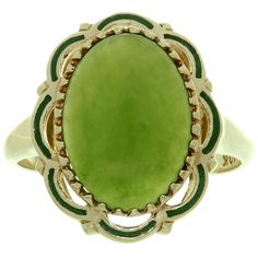 This classic estate collection ring is crafted in 10k yellow gold and is set with a cabochon green jade stone surrounded with a decorative green enamel border. The enamel has a small pinpoint deficiency. Made in United States circa 1960s. Measurements: 0.59" (15mm) width, 0.70" (18mm) length. The ring size is 7 - EU 54. Resizable. Sizing fees will be provided upon request. Suit Tattoo, Yellow Gold Cocktail Ring, Antique Show, Gold Cocktail Ring, Gold Cocktail, Convention Center, Jade Stone, Green Enamel, Gold Enamel