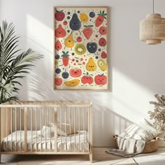 a baby crib in a white room with an art print on the wall above it