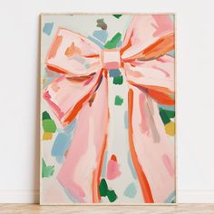 a painting with a pink bow on it